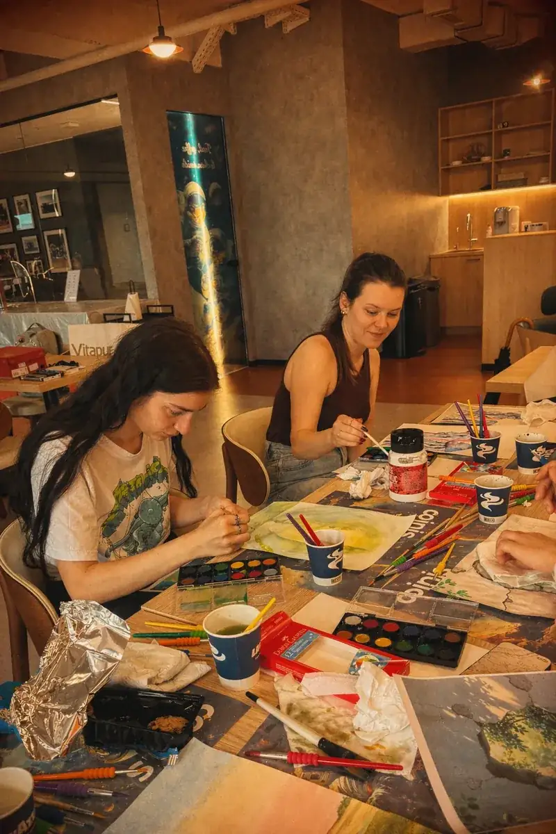 Coinis team creating art in the office