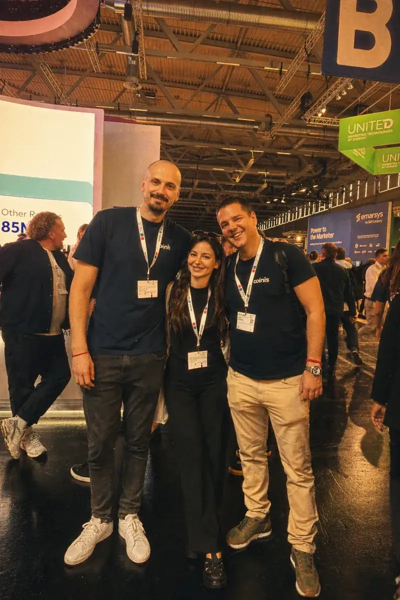 Coinis team networking at a conference