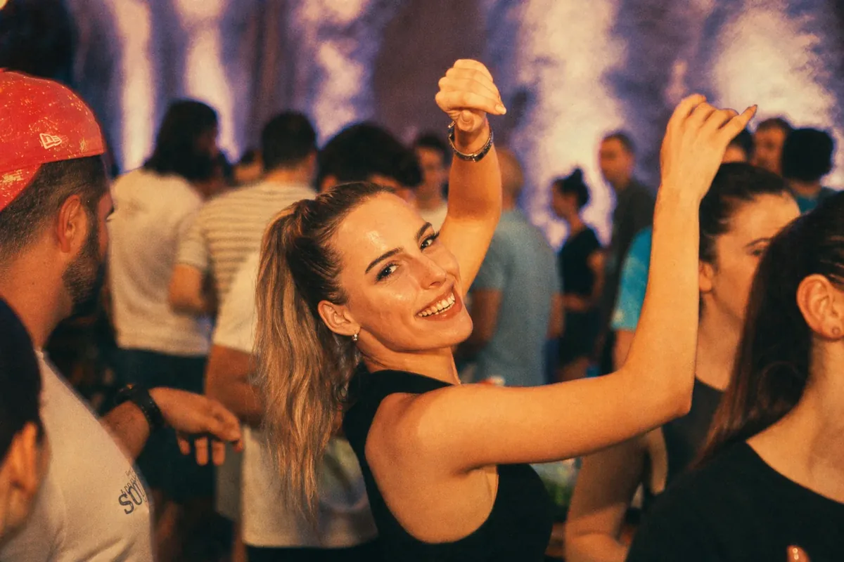 Coinis team dancing at a party