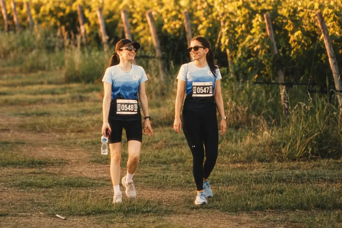 Coinis team walking through a vineyard