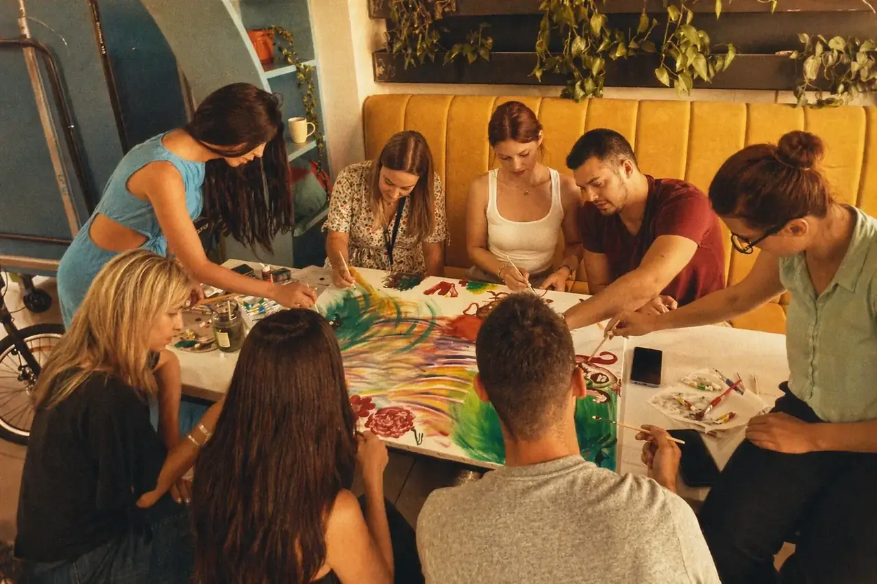 Coinis teammates in a creative art session with sketchbooks at the office