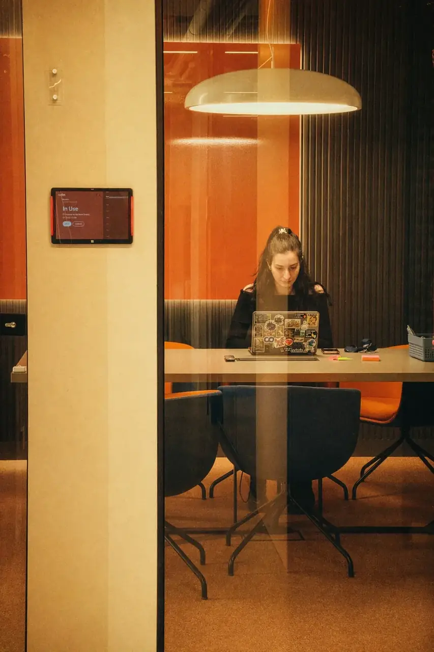Coinis teammates in a focused working session at a meeting room table