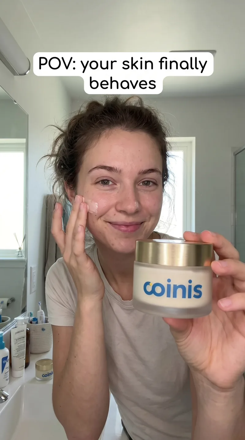 UGC style photo of a woman applying Coinis cream to her face