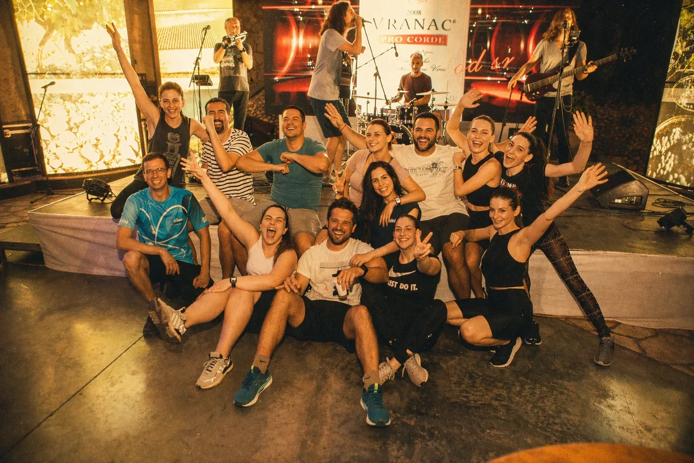 Coinis team enjoying a live band at an evening party