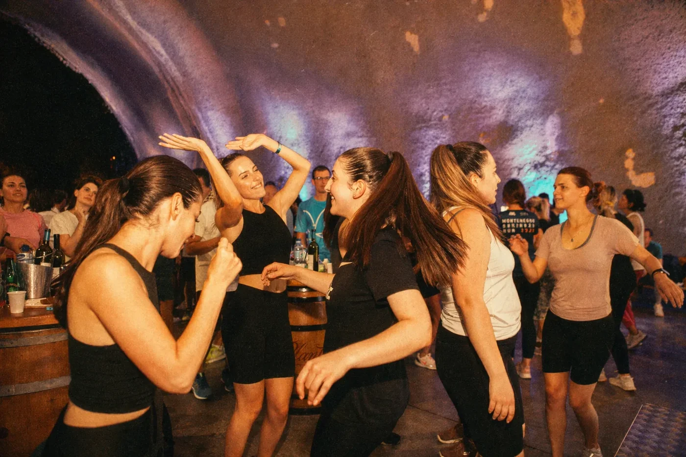 Group of Coinis teammates dancing together at a party