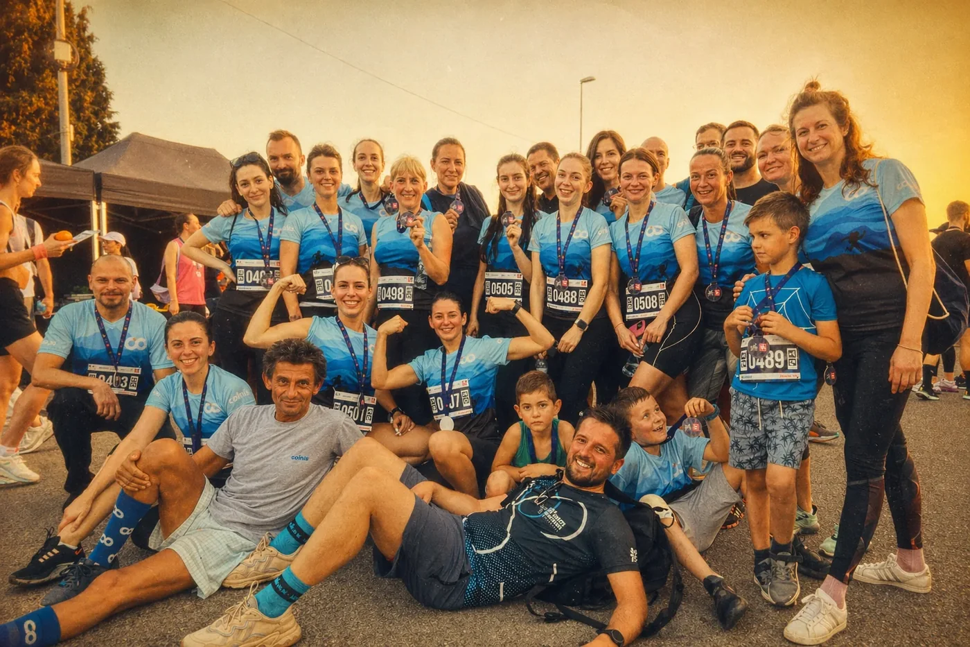 Coinis team group photo at the finish line of a race