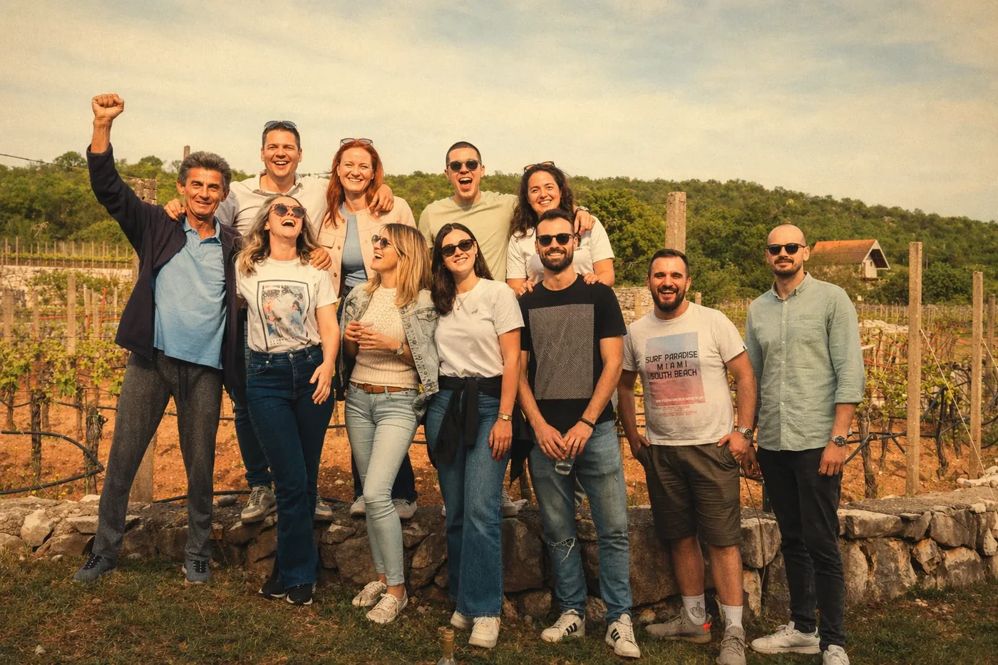 Coinis team posing for a group photo at a vineyard retreat